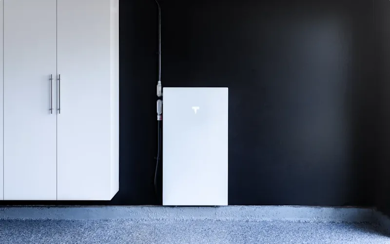 Tesla Powerwall 3 home battery with integrated solar inverter, installed in a garage